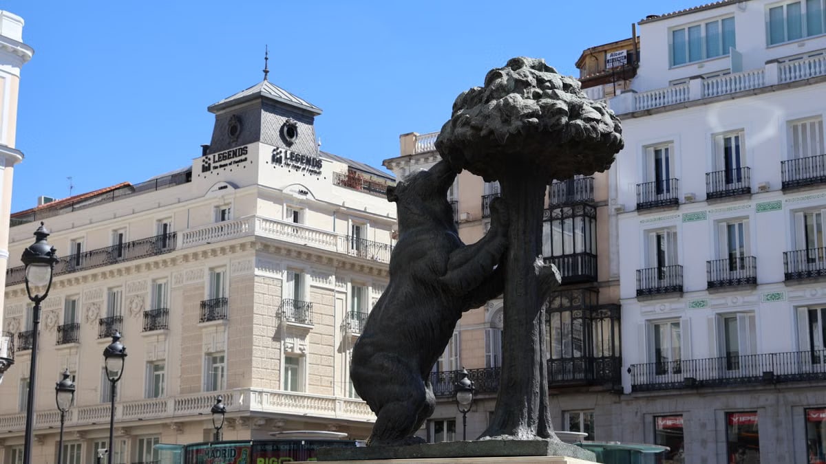 Iconic Bear and Strawberry Tree statue in Madrid's bustling Puerta del Sol.